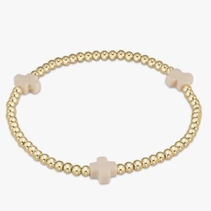 Elegant Gold Bracelet with Cream Cross Accents